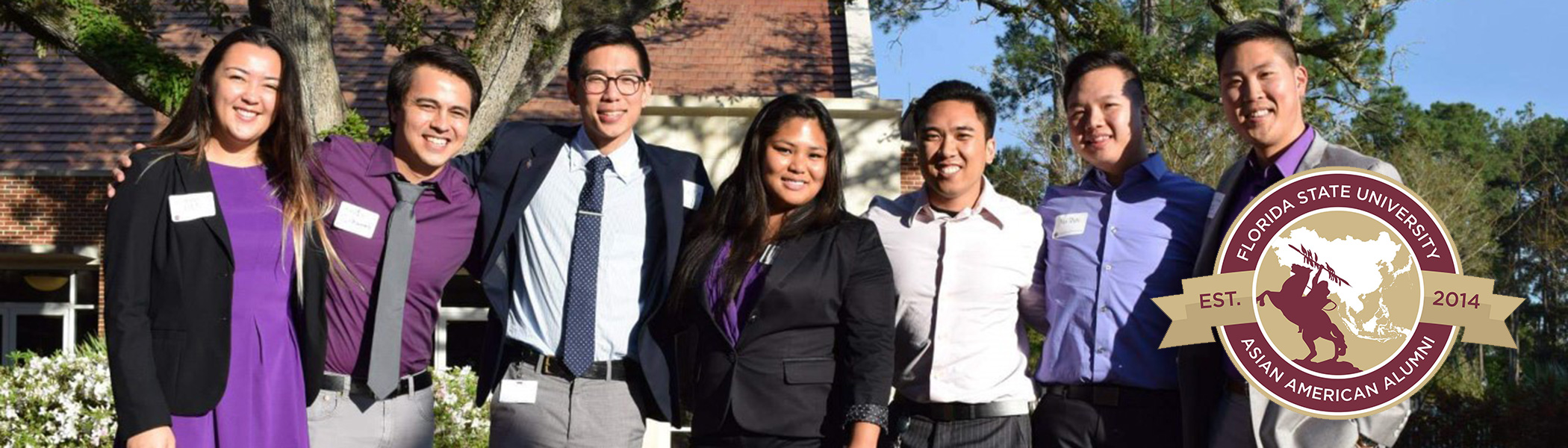 A group of asian american students standing and smiling