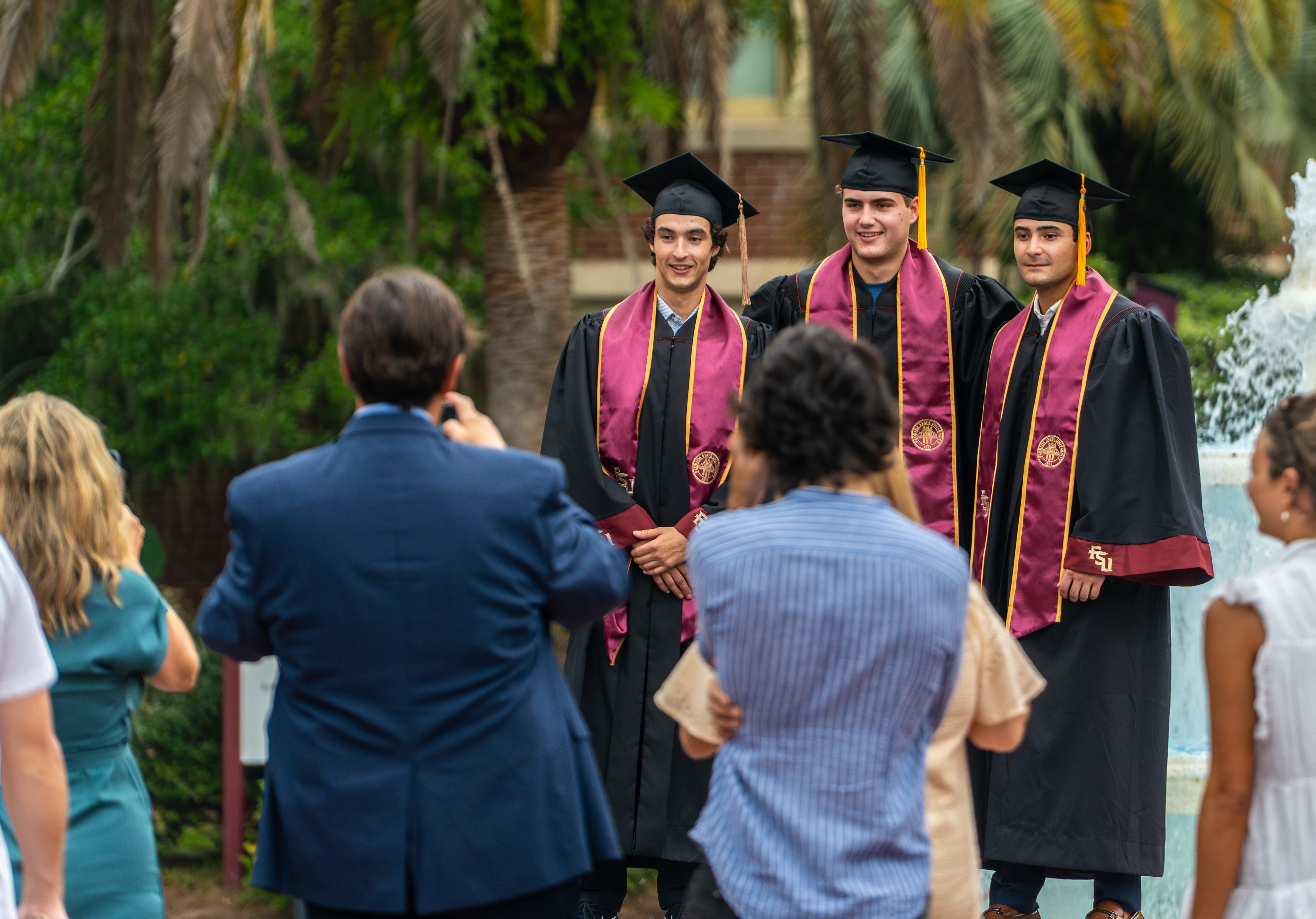 A photo of students and family at graduation.