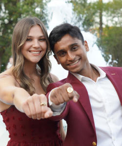 two students displaying rings