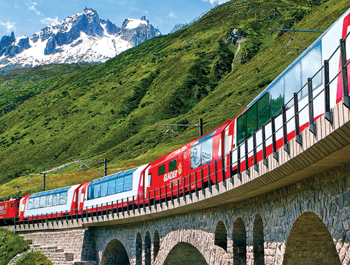 A photo of a train in the Alps