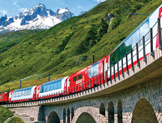 A photo of a train in the Alps